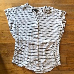 Polka dotted blouse with frills